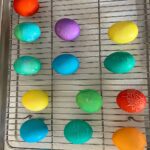 Assorted vibrant Easter eggs dyed with gel food coloring, displaying rich and even colors