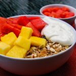 Selection of fiber and fermented foods like kimchi and yogurt, essential for a healthy gut microbiome