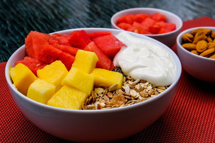 Selection of fiber and fermented foods like kimchi and yogurt, essential for a healthy gut microbiome