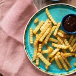 Reheated golden french fries in air fryer