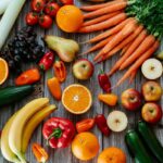 A variety of colorful diuretic foods including watermelon, celery, and green tea