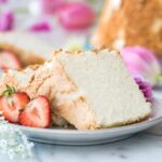 Angel Food Cake slices on a plate with strawberries