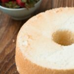 Angel food cake with fresh berries and whipped cream, a light and delicious dessert angel food cake