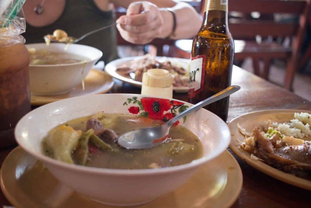 Bowls of soup and beer on a table