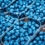 Selection of kidney-friendly fruits, including blueberries, cranberries, and strawberries