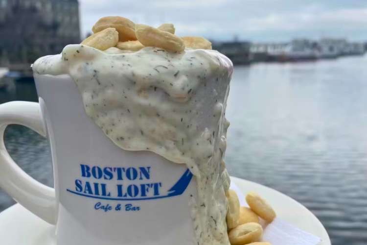 Bowl of New England Clam Chowder with oyster crackers