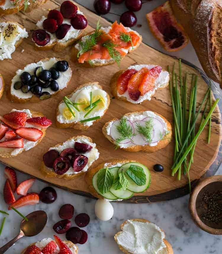 Assortment of canapés with various toppings on French bread