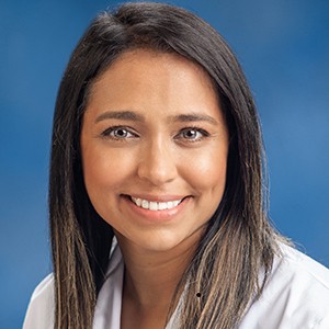 A pediatrician consulting with parents about baby's nutrition.