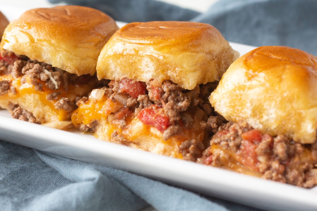 Beef sliders on a serving platter.