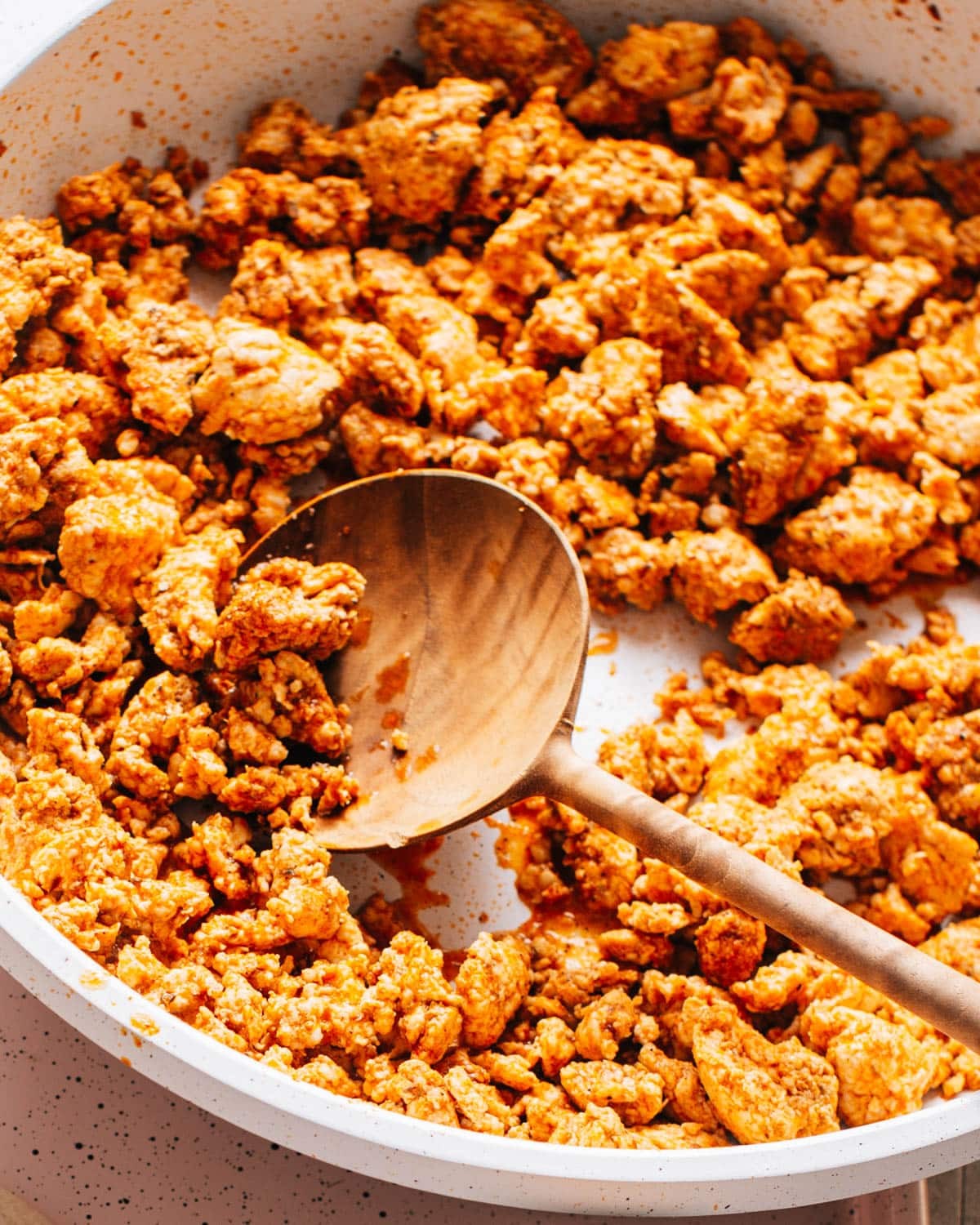 Seasoned chicken being cooked in a skillet, ready to be used in a variety of Mexican dishes.