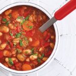A hearty bowl of vegetable and bean goulash, showcasing the rich textures and colors of this protein-packed dish
