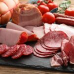 A side-by-side comparison of processed meats with and without nitrates, highlighting the alternative curing methods and labeling differences.