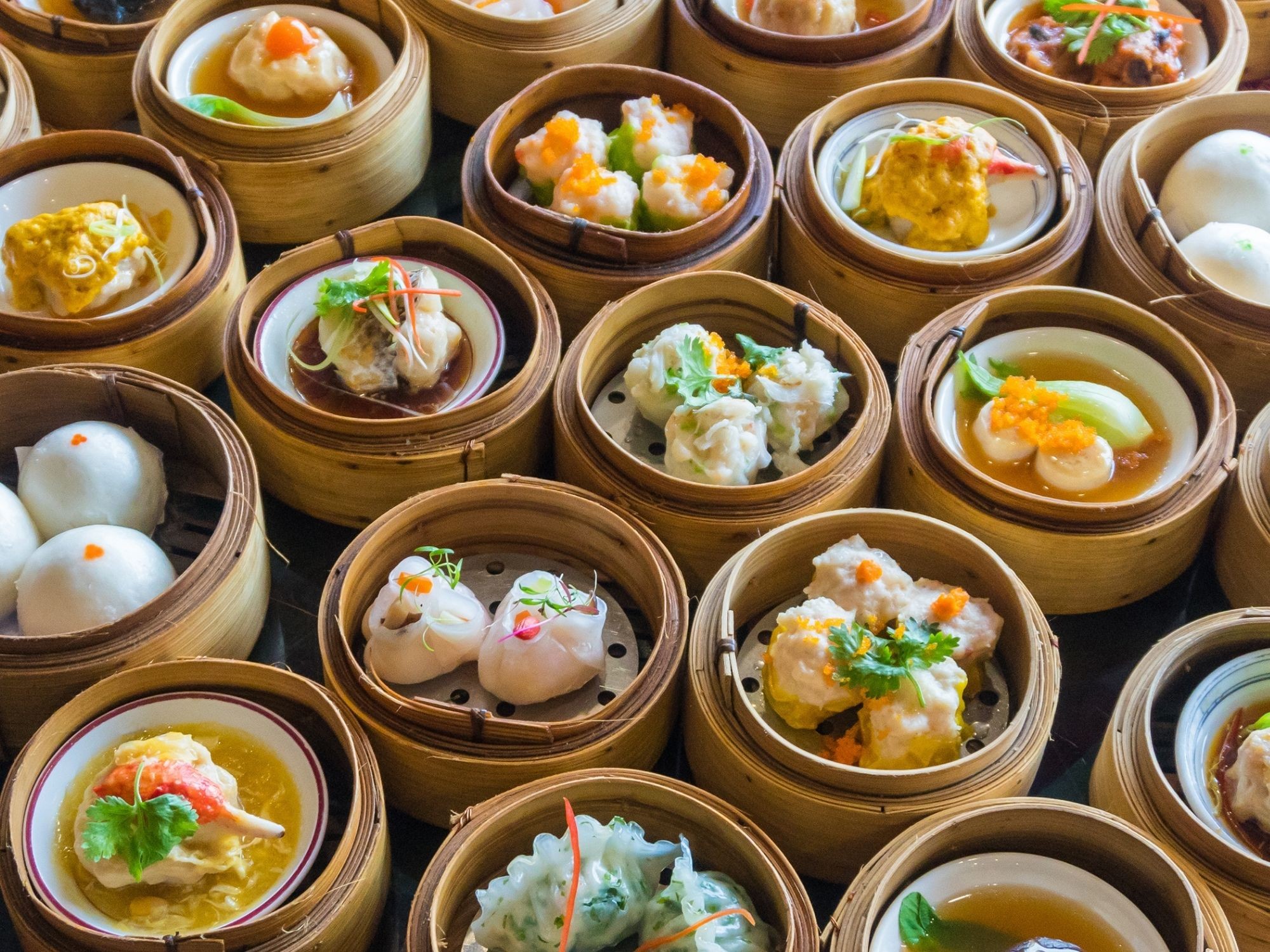 A collage of diverse foods sampled during a NYC food tour, representing the city's rich culinary landscape.