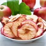 Dried apple slices in a white bowl