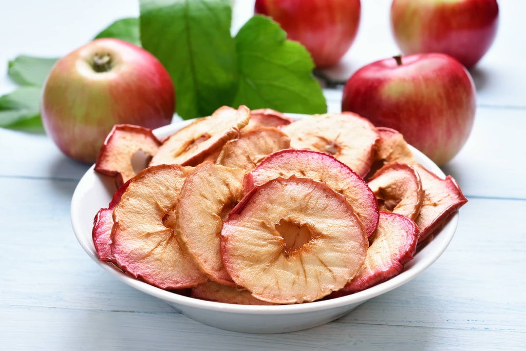 Dried apple slices in a white bowl