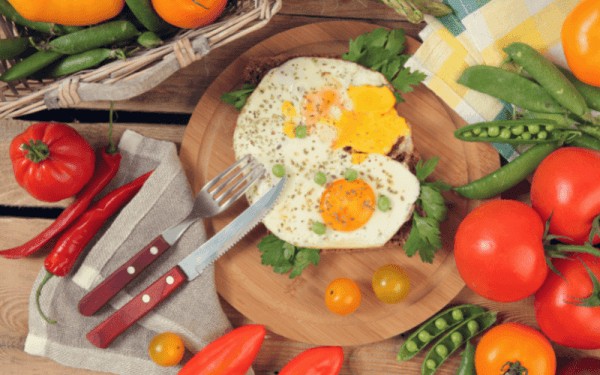 Brown eggs in a carton, representing a common vegetarian food
