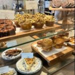 Colorful array of dishes displayed in a cozy, modern restaurant setting