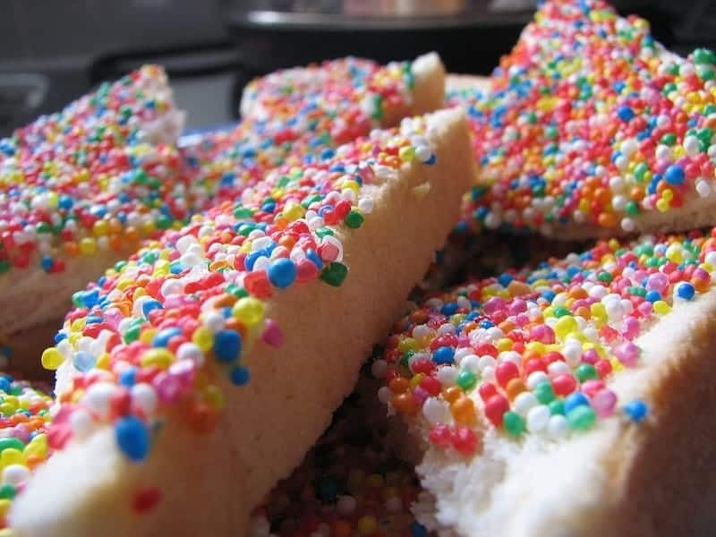 Fairy bread, slices of white bread covered with butter and colorful sprinkles, commonly served at children's parties.