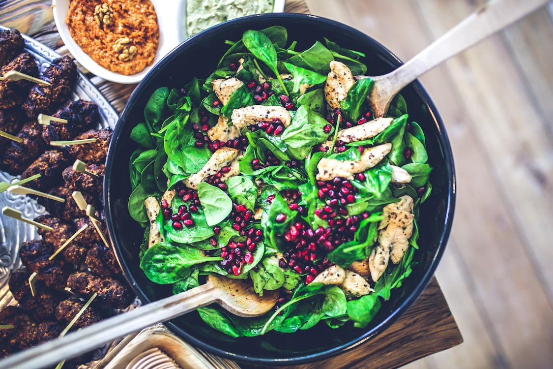 Selection of foods high in sugar and fat, including soda, fried foods, and processed snacks