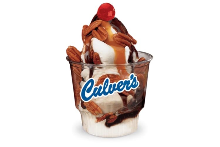 A sundae topped with a cherry.