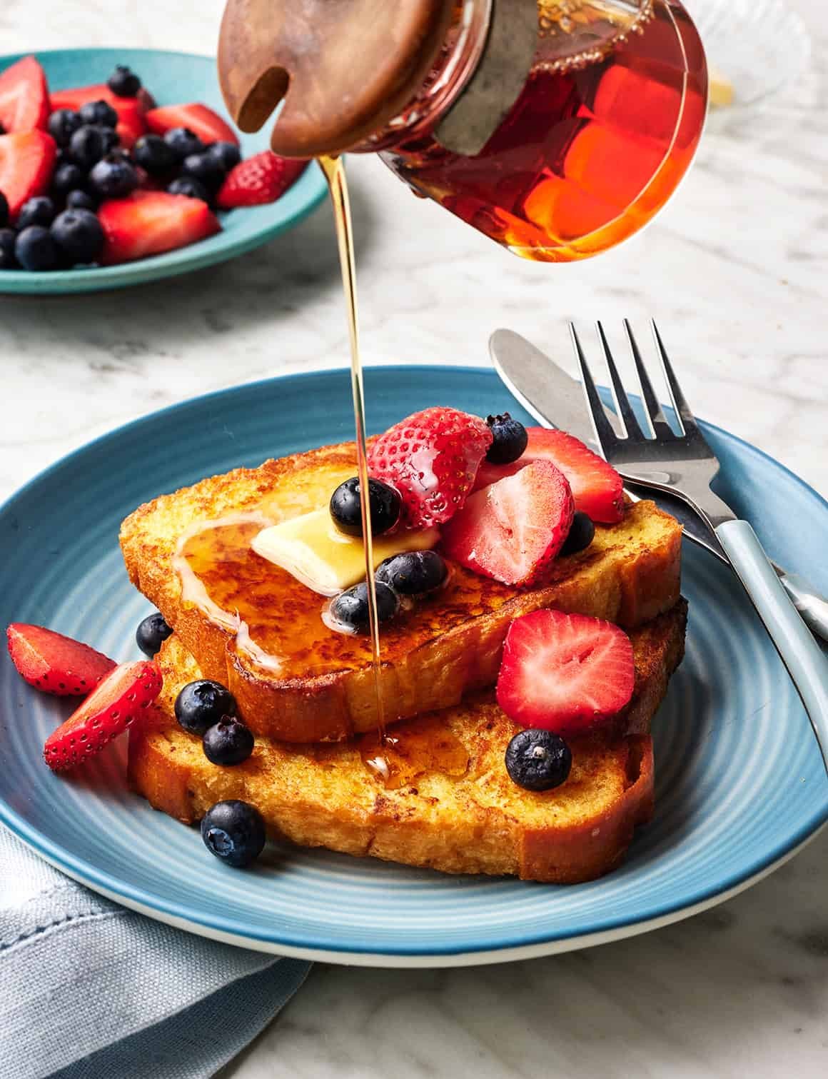 Classic French toast topped with syrup and fruit