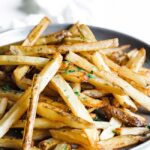 Plate of Belgian fries with various sauces