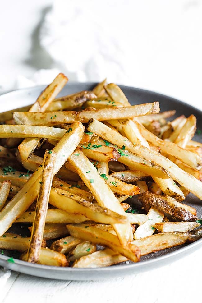 Plate of Belgian fries with various sauces