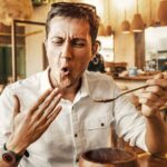 Close-up of a person sweating while eating extremely spicy food