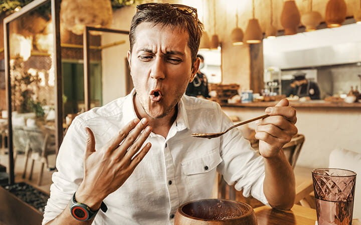 Close-up of a person sweating while eating extremely spicy food