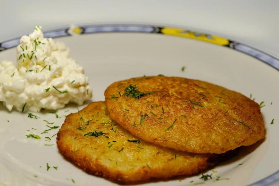 German Potato Pancakes Kartoffelpuffer served with applesauce