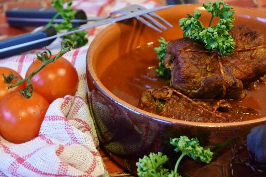German Rouladen served on a plate with vegetables