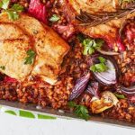 Overhead shot of pork with rhubarb and grains