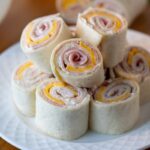 Taco Pinwheels ready to serve, showcasing seasoned ground beef, salsa, cheese, and black olives