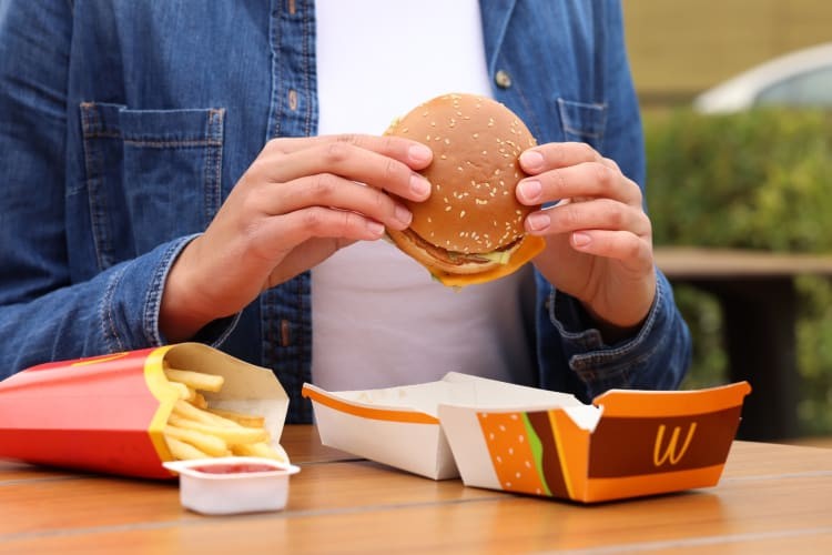 A person eating a McDonald
