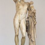 Hermes Carrying the Infant Dionysus, marble statue by Praxiteles, showcasing the divine origins and upbringing of the god of wine and revelry