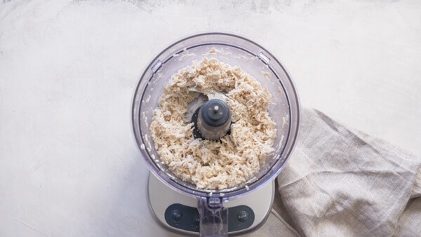 Shredded chicken breast in a food processor