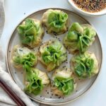 Pork and corn dumplings ready to be steamed, showcasing the vibrant colors and textures of the ingredients.