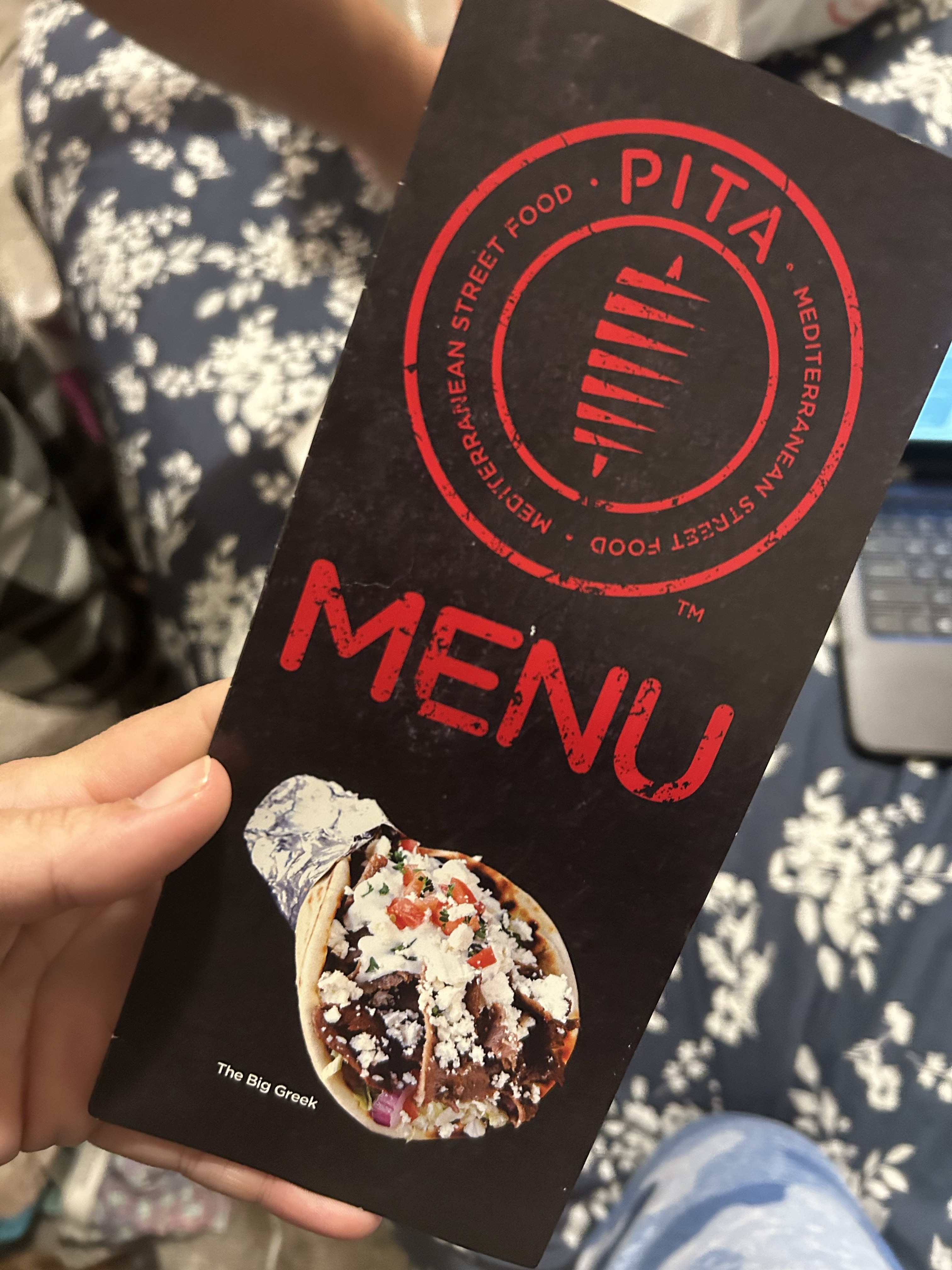 Pita bread topped with feta and herbs