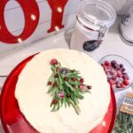 Christmas Tree Cake decorated with rosemary and cranberries for a festive dessert