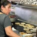 Pupusa revuelta filled with pork, beans, and cheese from Express Pupuseria