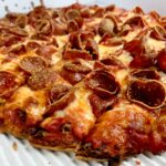 Columbus-style pizza with thin crust and generous pepperoni