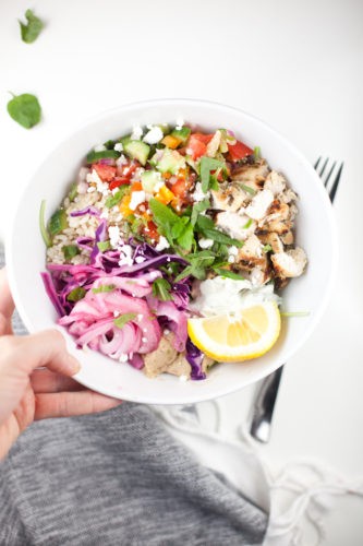 A vibrant Mediterranean Grain bowl, copycat Cava style, showcasing a healthy and macro-friendly meal