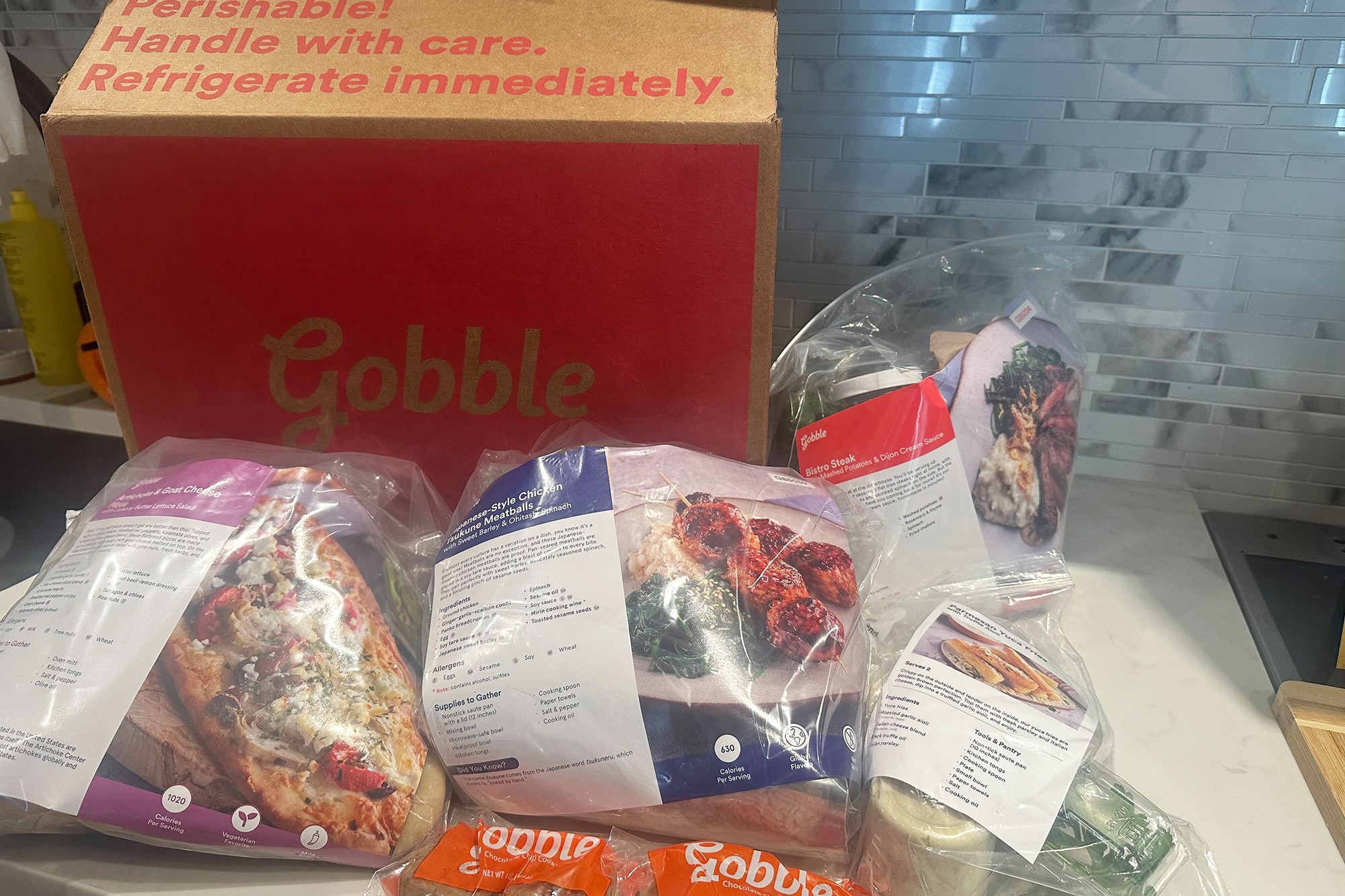 Food in plastic bags next to a box