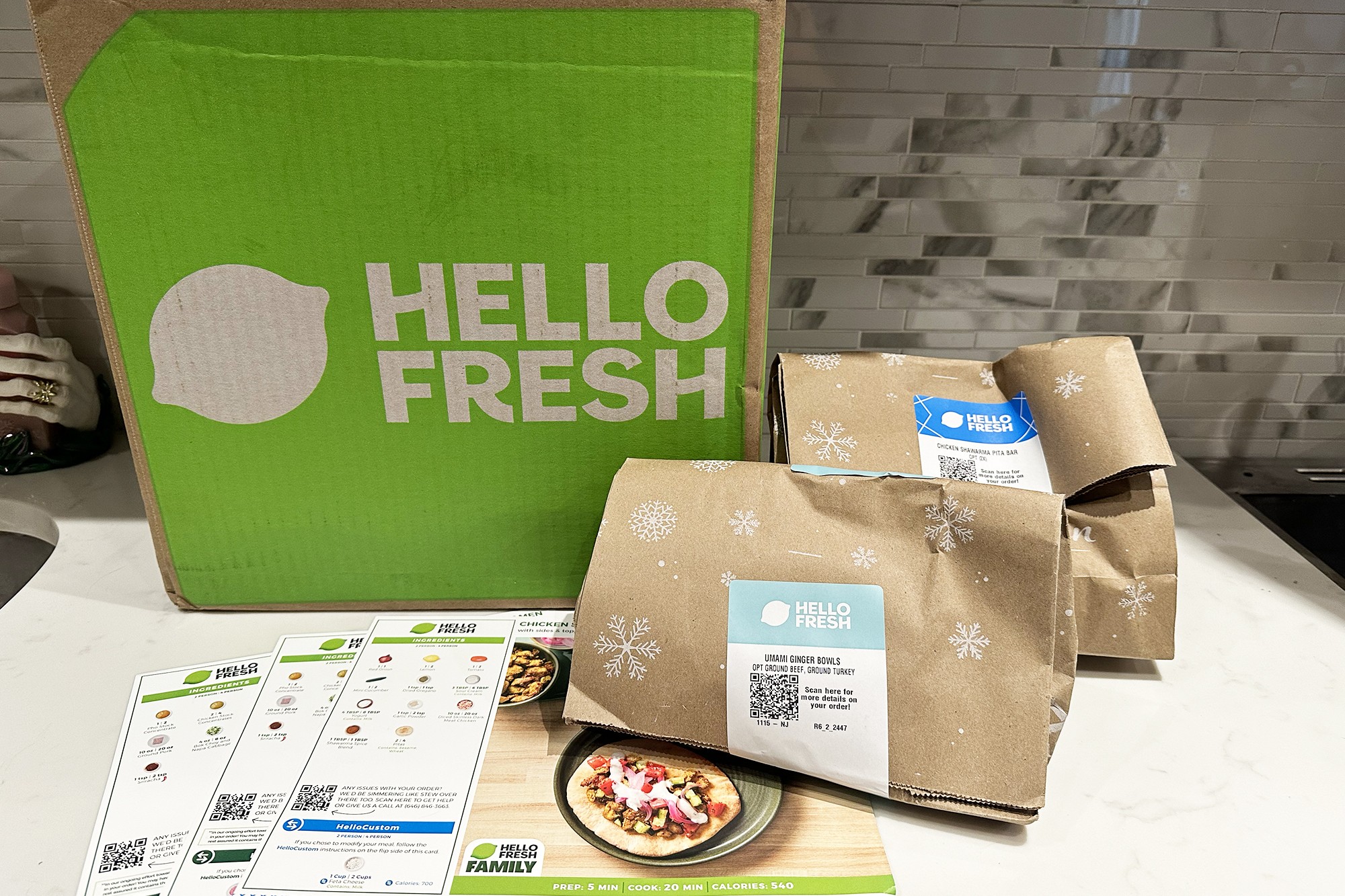 A group of brown bags next to a green box