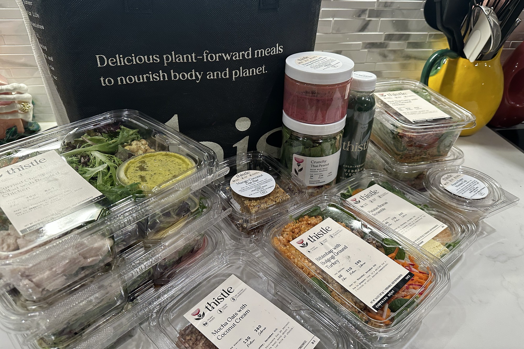 A group of plastic containers filled with food