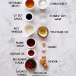 Ingredients for making Chinese garlic sauce, including garlic, soy sauce, vinegar, and sugar
