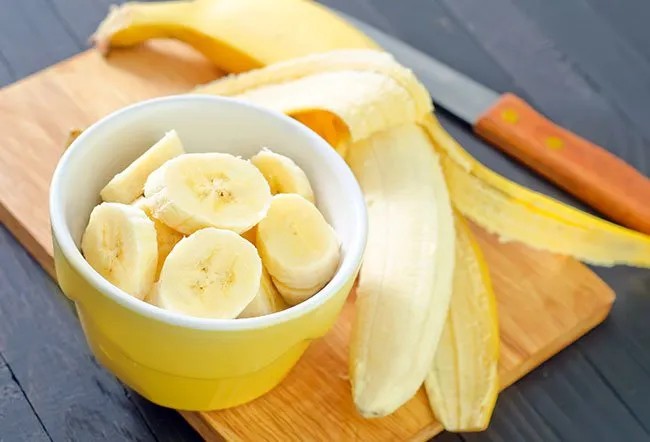 A close-up shows vibrant, ripe bananas ready to offer their energy. Their bright yellow skin promises a nutritious start to any morning.