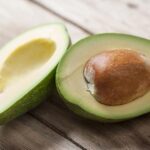 Mashed avocado in a small bowl, ready for baby consumption