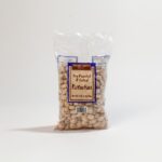 Assortment of Trader Joe's products on a store shelf, showcasing the variety of offerings.