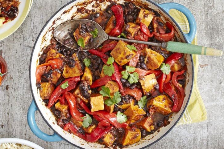 Pot of sweet potato, pepper and black bean curry